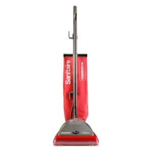 A red upright vacuum cleaner with the handle down.